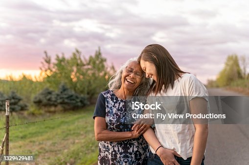istock Ethnic Senior Mother Walking With Her Adult Daughter 1329429481