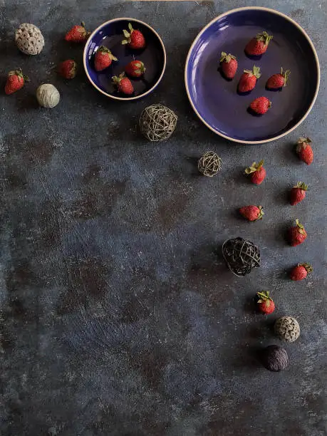 Darkmood photo background with strawberries theme