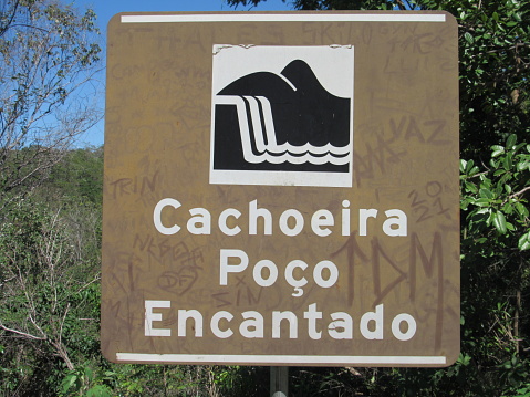 Street sign to Poço Encantado, Chapada dos Veadeiros, Goias state, Brazil.
