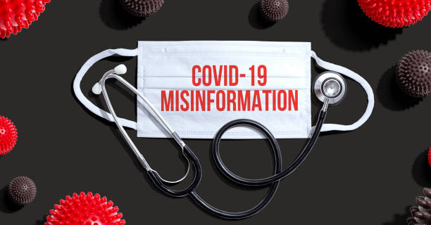 Covid-19 Misinformation theme with mask and stethoscope stock photo