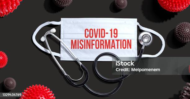 Covid19 Misinformation Theme With Mask And Stethoscope Stock Photo - Download Image Now