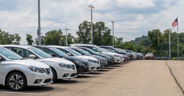 New Nissan cars lined up at a dealership in Wilkins Township, Pennsylvania, USA stock photo
