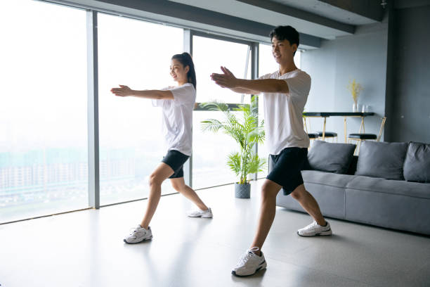 istock Young asian couple exercising together 1329442809