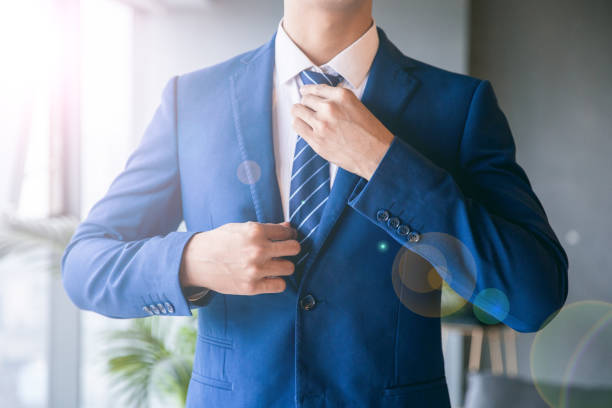 istock Businessman dressing suit at home 1329442902