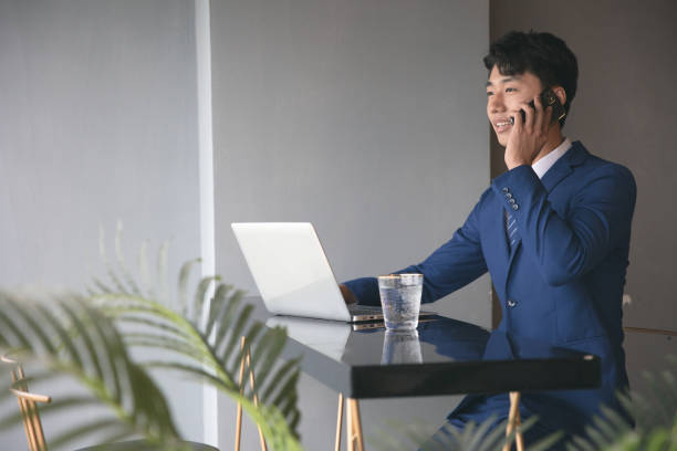 istock Young businessman working at office bar 1329443513