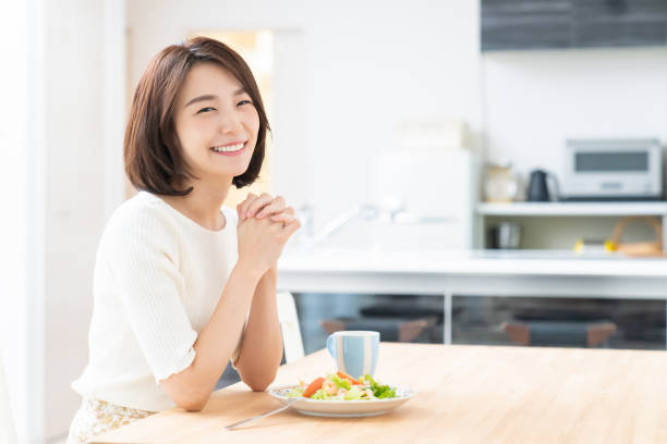 istock attractive asian woman who eats 1329445541