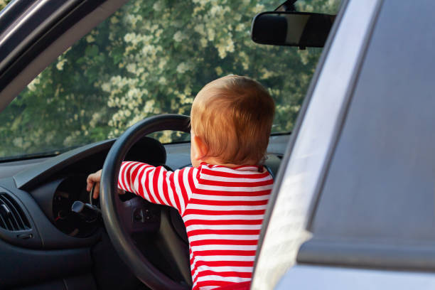 istock Baby boy driver. Travel with kids concept. 1329445705