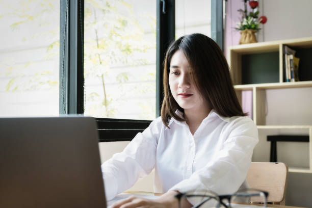 istock freelance concept,female using computers to design work as ordered by customers at home. 1329447129