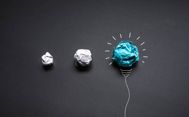istock Ideas with paper crumpled  ball with lightbulb.business creativity and solution 1329447981