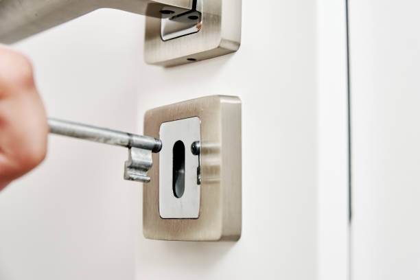 istock Woman open keylock at room door 1329451757