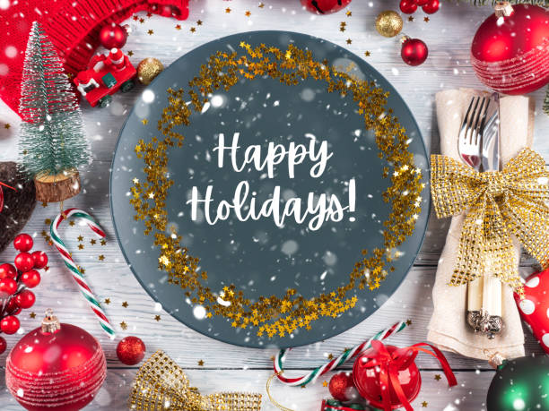 istock Christmas festive dinner table setting with blue plate, text wishing happy holidays 1329452096