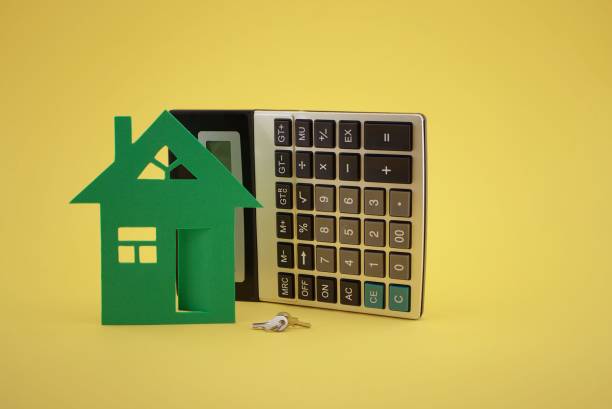 istock House and and calculator on yellow background 1329452099