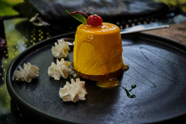 istock Dessert. Mango passion fruit with cherry and green mint. 1329453102