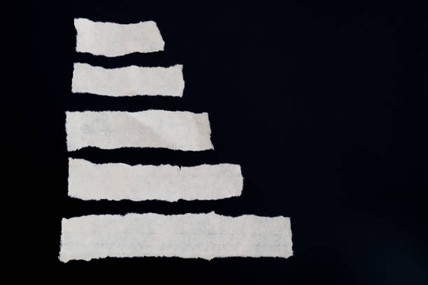 istock Scraps of paper on black background 1329455465