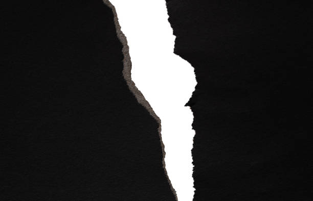 istock Background of torn black paper 1329455545