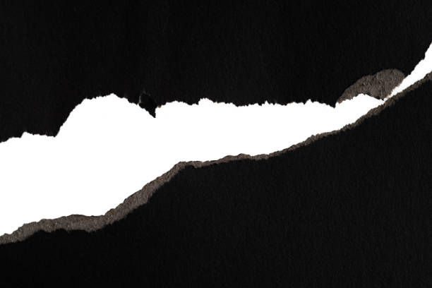 istock Background of torn black paper 1329455562