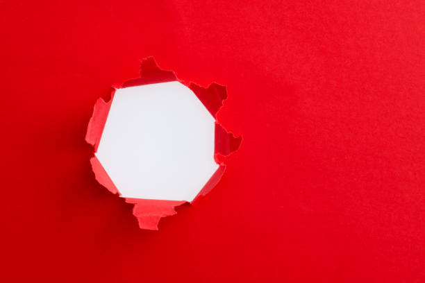 istock Red paper with a round hole 1329455645