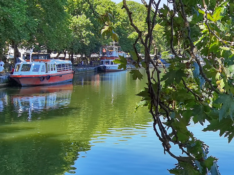 ioannina  city beside the lake pamvotis, in summer season,green  platanus trees lake boats , greece