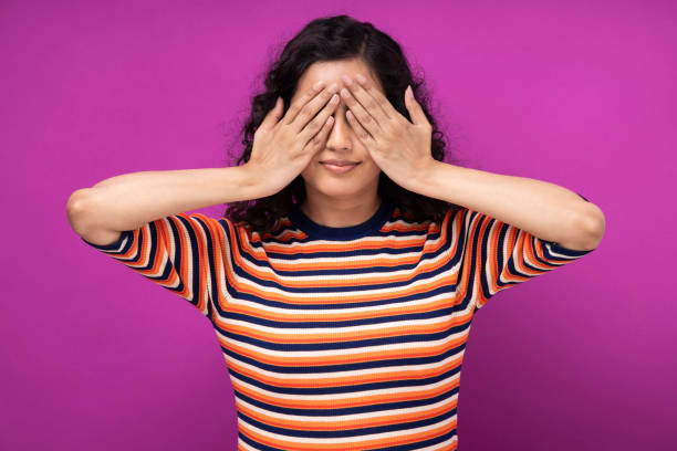 A Blindfolded Woman with Her Hands on Her Face · Free Stock Photo