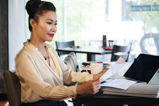 istock Business lady reading agreement 1329460842