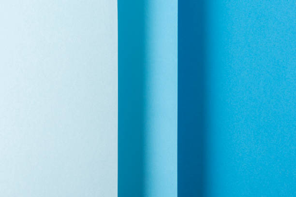 istock Colorful blue folded paper material design vertically. Top view, flat lay 1329461809