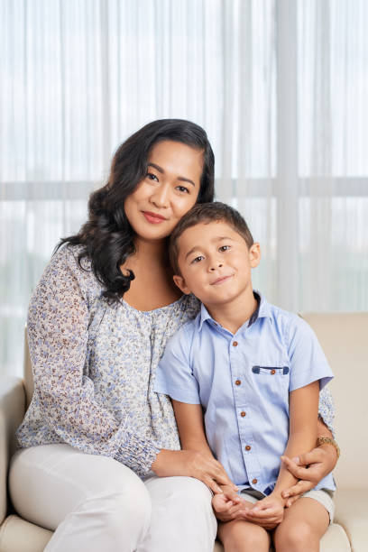 istock Asian family sitting at home 1329461818