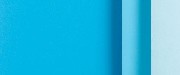 istock Colorful blue folded paper material design. Top view, flat lay. Banner 1329462010