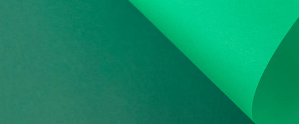 istock Design background curved background from green cardboard. Top view, flat lay. Banner 1329462117