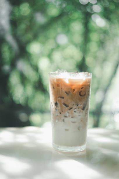 istock Iced latte coffee in a glass with fresh milk layer. Refreshing beverage for summer 1329463023