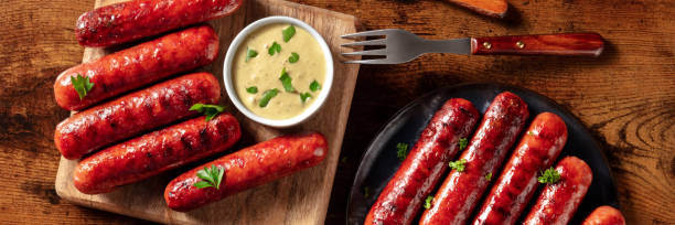 istock Sausage panorama with mustard sauce, shot from the top 1329463277