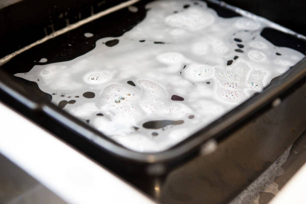 istock Bowl of soapy water in a kitchen sink 1329465913