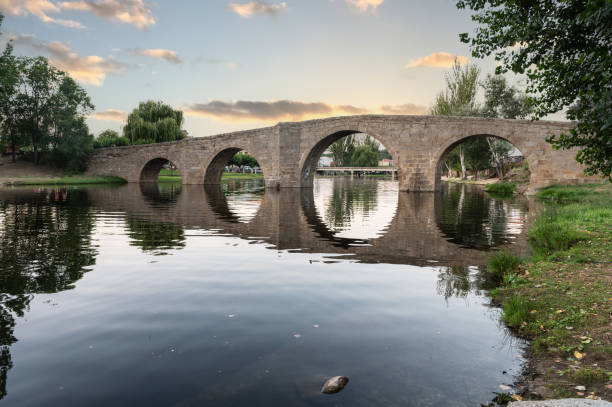 istock The so-called Old Bridge or Romanesque Bridge crosses the Alberche River as it passes through the Spanish municipality of Navaluenga, in the province of Ávila (Spain) 1329466976