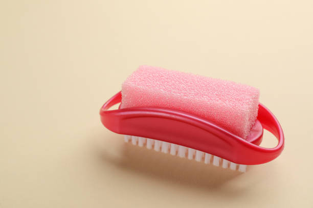 istock Pedicure tool with pumice stone and brush on beige background 1329467142