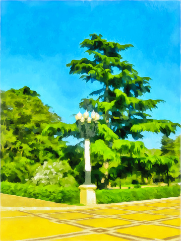 Watercolor city landscape. Urban park, paved paths with tiles. Street lamp on the background of a fir tree. Travel and vacation concept.  Digital painting, illustration. Watercolor drawing.