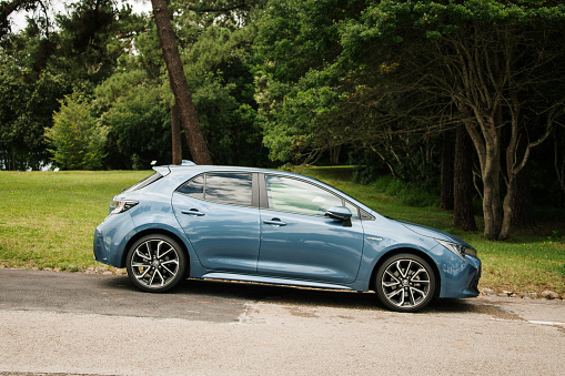 Santander, Spain - 12 July 2021: A side view of a new Toyota Corolla parked in a street in Santander, Spain