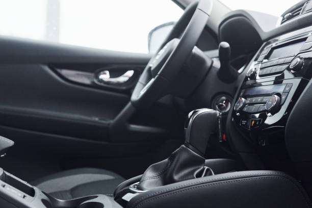 istock Steering wheel and front panel. Modern new luxury automobile interior. Design and technology 1329470905
