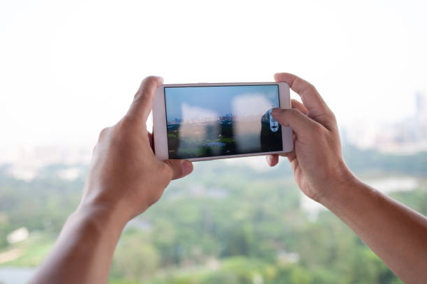 istock take photo with  smart phone 1329471763