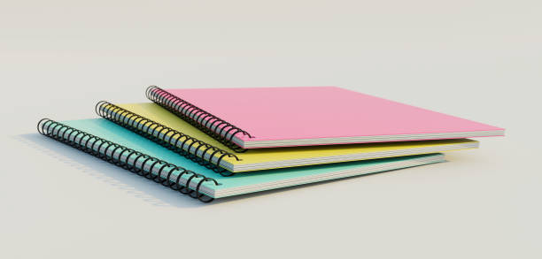 istock Stacked spiral binder notebooks. Blank colourful notebooks. Side view. 1329473381