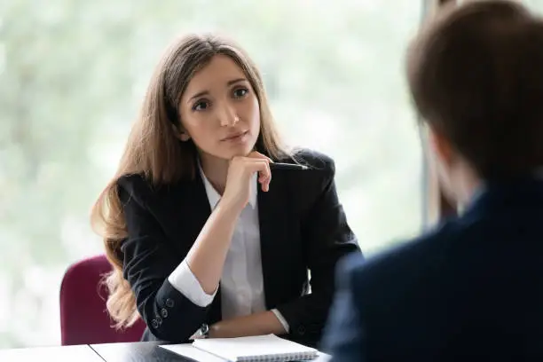 Photo of Engaged recruiter, recruit agent talking to job candidate on interview