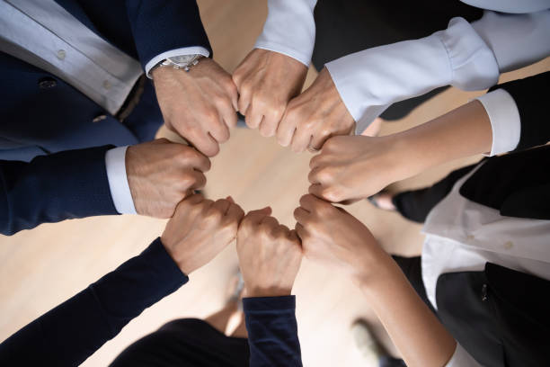 Business team showing expressing strong motivation, engaged in teambuilding activity