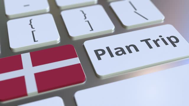 PLAN TRIP text and flag of Denmark on the computer keyboard, travel related 3D animation