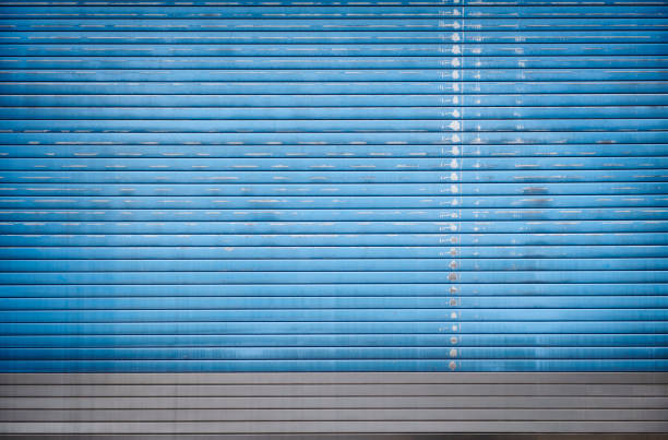 High Res photograph of a metal rolling garage door.