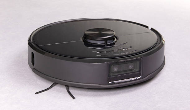 istock Robot vacuum cleaner on a grey floor 1329480993