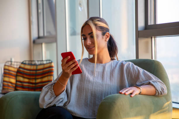 istock Beautiful woman working at home with new technologies 1329483504
