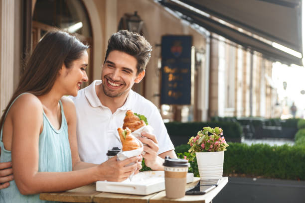 istock Smiling young couple having lunch 1329483838