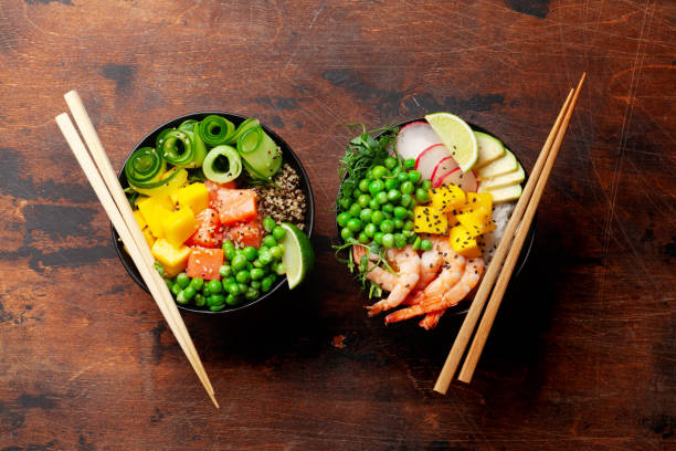 istock Poke bowls with shrimps, salmon, avocado and mango 1329484154