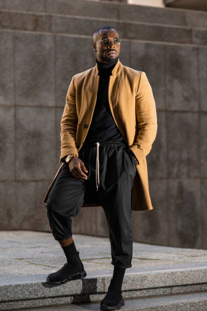 istock Black model posing wearing elegant stylish suit. 1329485031