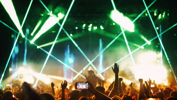 istock Large group of people at a concert party. 1329487537