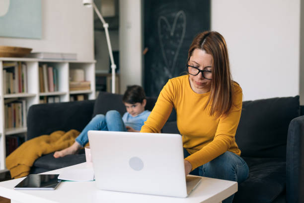 istock mother with kids at home 1329488174