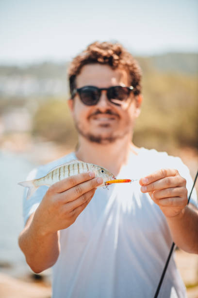 Fisherman Showing His Catch